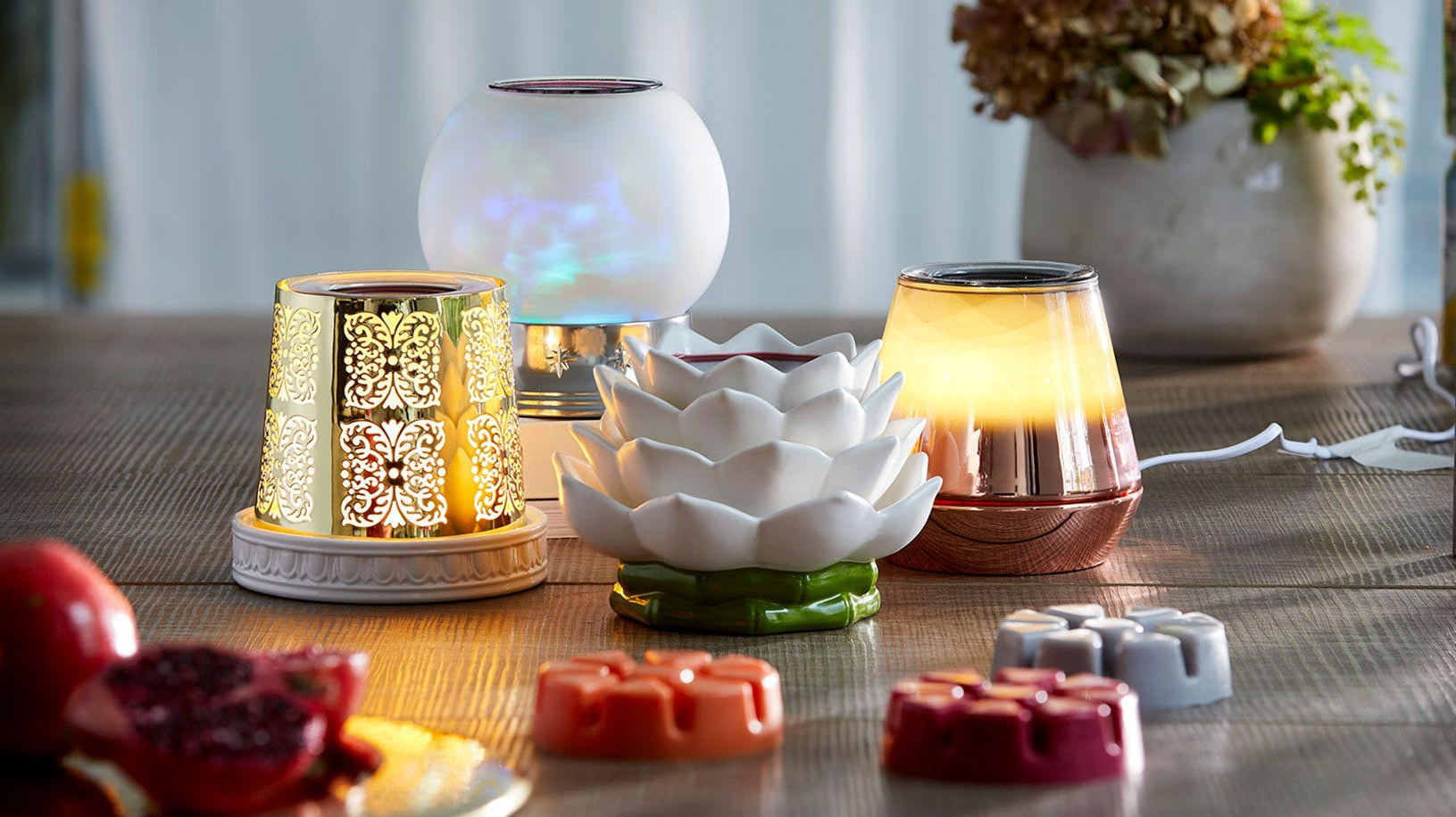 A variety of ScentGlow Warmers on a table